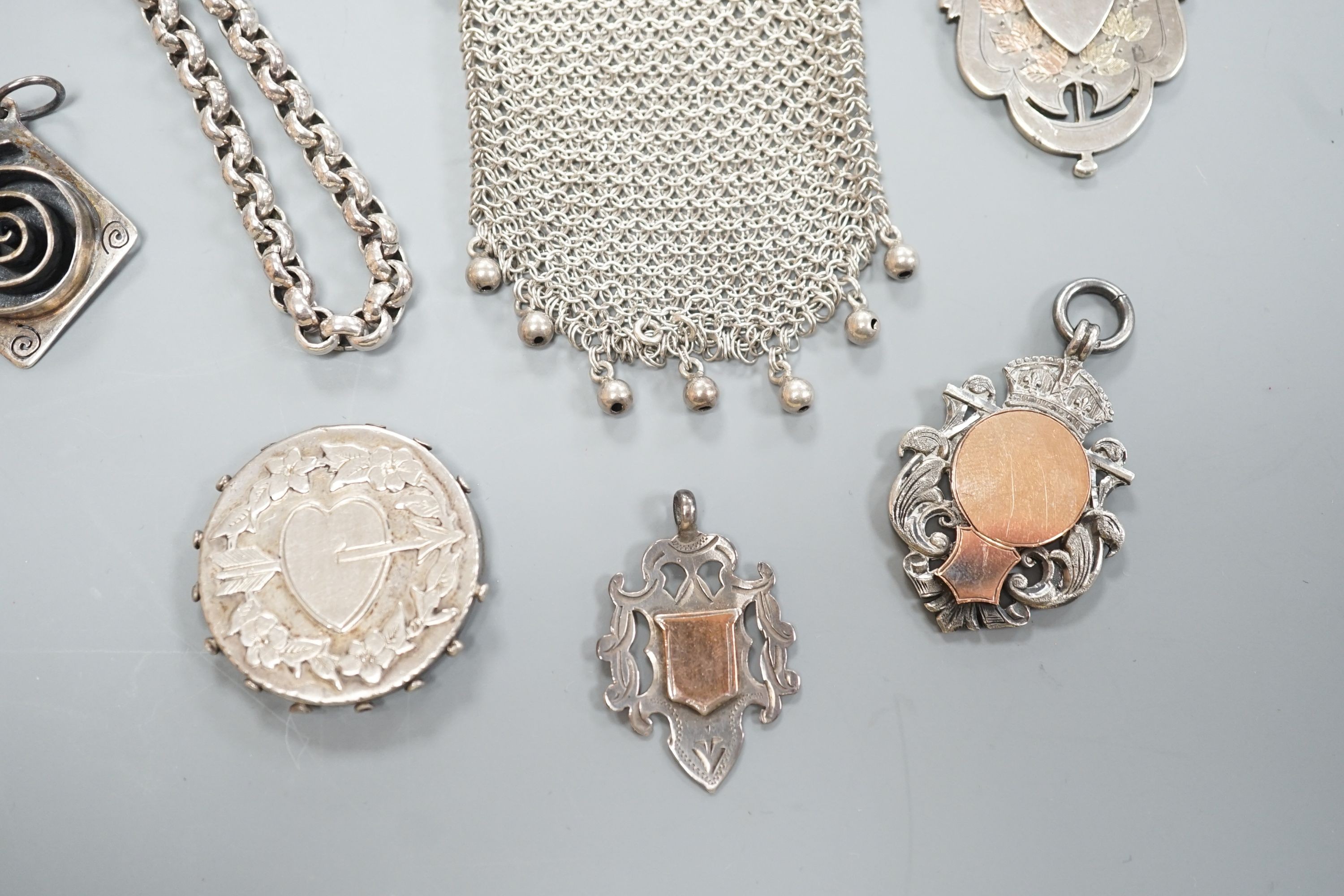 A small group of mainly silver and white metal jewellery including belcher chain, brooches, medallions, evening purse etc. and two silver pocket watch cases.